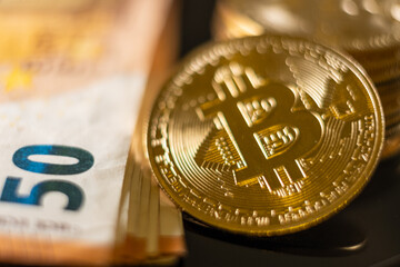 bitcoin golden coin and 50 euro note bill  - obrazy, fototapety, plakaty