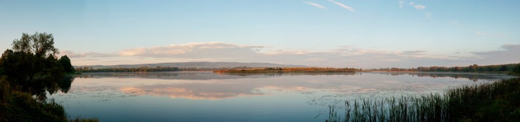 Panorama lake view in sunrise time .Sunrise at the lake