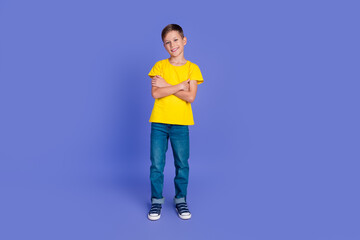 Fototapeta na wymiar Full length photo of adorable cute nice boy wear trendy yellow clothes crossed arms isolated on violet color background