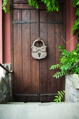   Wooden Gate With Large Hinged Iron Lock In The Village .  Rustic style