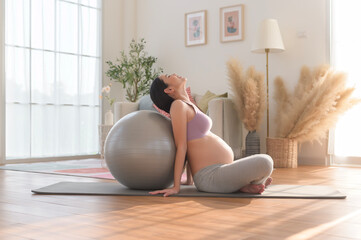 Healthy pregnant woman exercising and doing prenatal yoga, meditation, working out, yoga, pregnancy...