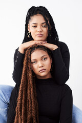 Sisters, portrait and fashion in studio, clothes and style bonding on white background. Women,...