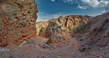 Northern Kyrgyzstan. Picturesque winding trails of the Kok Moinok canyons with red-brown rock along the Chu River.