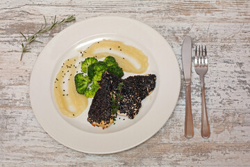 Black Sesame Seed Chicken Fillets With Broccoli and Mash Potatoes Tabletop
