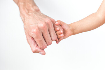 child holding dad's finger, close-up, face not visible, concept of fatherhood and father's day
