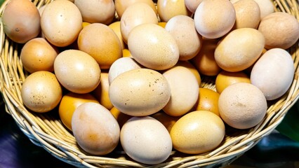 Basket of fresh, natural eggs, reflecting trend towards organic and free-range products at local...