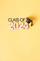 Class of 2024 text with graduation cap. Graduation holiday concept.