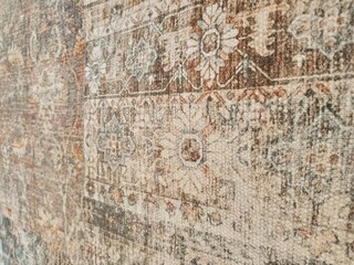 Fototapeta premium Close up photo of handmade wool Persian carpet. Very beautiful textile design and nice motif. 