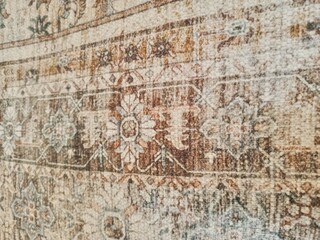 Fototapeta na wymiar Close up photo of handmade wool Persian carpet. Very beautiful textile design and nice motif. 
