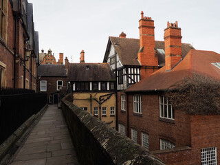 buildings crowded along the city wall in chester city centre