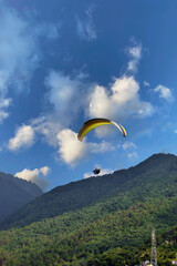 Beautiful landscape view with Paragliders in the sky at Bir Billing Himachal Pradesh.