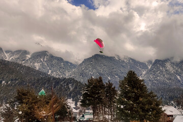 Beautiful landscape view with Paragliders in the sky at Bir Billing Himachal Pradesh.