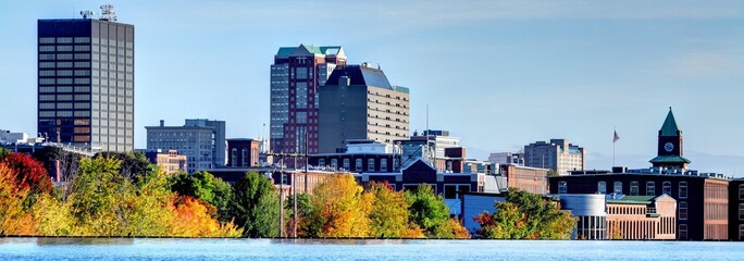 Autumn Splendor: Stunning 4K image of Manchester, New Hampshire Skyline Along the Merrimack River