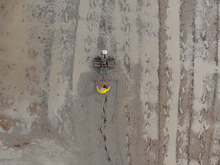 Farmers cultivate rice fields using hand tractor