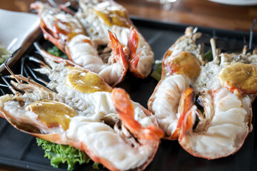 Grilled river prawns served on plate with vegetable