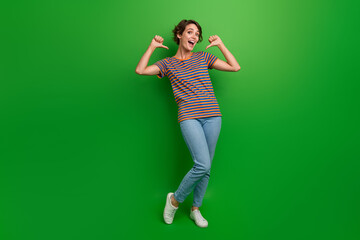 Full body portrait of crazy positive lady indicate thumb fingers self herself isolated on green color background
