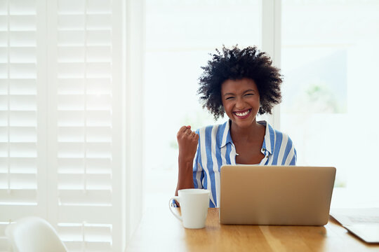 Portrait, black woman and laptop in home with celebration for career success, entrepreneur and fist. African female author, tech and achievement in house with victory, happiness and best selling book