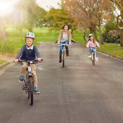 Naklejka premium Boy, family and bicycle for fun outside, road and mother with sister in nature for bonding and childhood development. Growth, helmet and safety, riding and children in neighbourhood with parent
