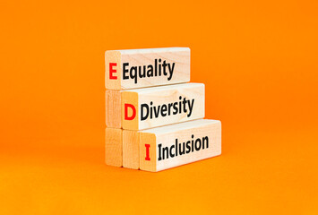 EDI equality diversity inclusion symbol. Concept words EDI equality diversity inclusion on blocks. Beautiful orange background. Business EDI equality diversity inclusion concept. Copy space.