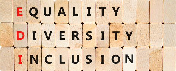 EDI equality diversity inclusion symbol. Concept words EDI equality diversity inclusion on blocks on a beautiful wooden background. Business EDI equality diversity inclusion concept. Copy space.