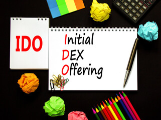 IDO initial DEX offering symbol. Concept words IDO initial DEX offering on beautiful white note....