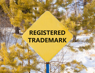 Registered trademark symbol. Concept word Registered trademark on beautiful yellow road sign....