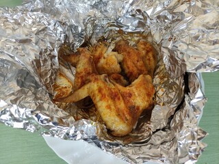 Chicken wings baked in foil with seasonings