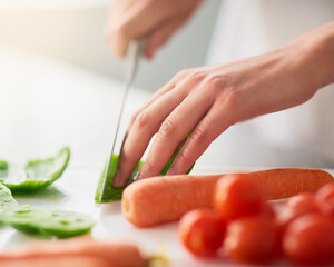Cooking, hands and knife for vegetables on counter in kitchen of home for diet, health or...