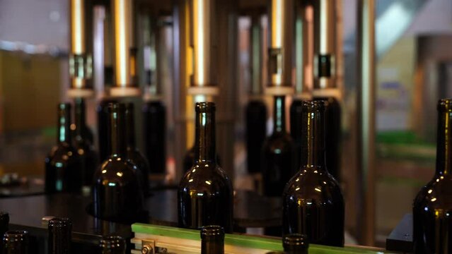 Machinery takes wine from aging vats into bottles and onto production lines in wineries.