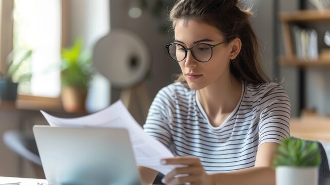 Woman Concentrating on Documents