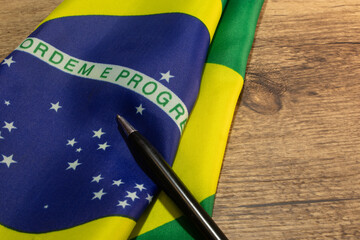 LAURO DE FREITAS, BRAZIL - April 26, 2024 : brazilian flag with a pencil