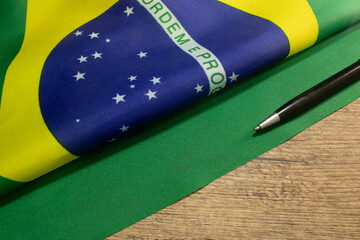 LAURO DE FREITAS, BRAZIL - April 26, 2024 : brazilian flag with a pencil