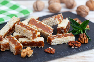 Waffle, Caramel and Walnuts Slices. Homemade waffle cakes. Turkish dessert - Grilijas or grilias.