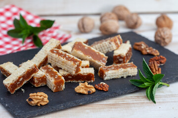 Waffle, Caramel and Walnuts Slices. Homemade waffle cakes. Turkish dessert - Grilijas or grilias.