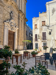 Fototapeta na wymiar A Church square under a deep blue sky in Puglia, Italy