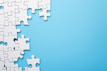 White jigsaw puzzle completed on serene blue background, representing completion
