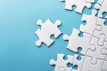 Close-up of a completed white jigsaw puzzle on blue backdrop
