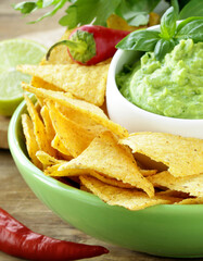 nacho corn chips and guacamole sauce