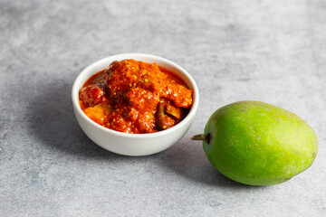 selective focus of Mango Pickle with green sliced mango. 