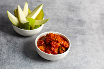 selective focus of Mango Pickle with green sliced mango. 