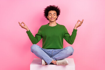 Photo of happy guy sit podium train yoga relaxation isolated pastel color background