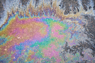 Oil stain, Gas Stain drop from the Car on the Parking Lot Floor. - obrazy, fototapety, plakaty