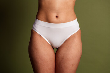 No retouch cropped photo of lady underwear lingerie accepting herself isolated green color background