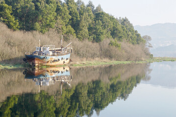 Abandoned old river boat