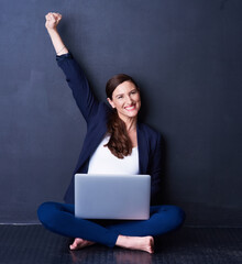 Portrait, woman and laptop in celebration with fist for winning, success or promotion bonus. Happy,...