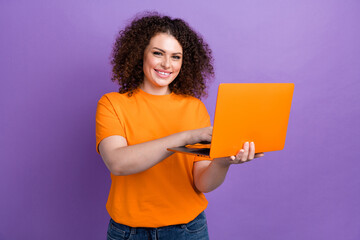 Photo of cheerful positive lady dressed orange t-shirt communicating instagram twitter telegram...