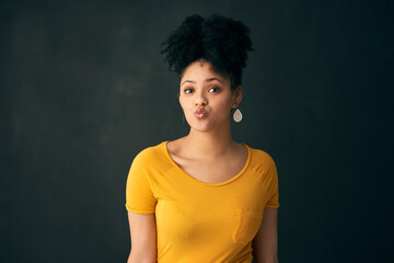Confident, portrait and black girl with pout, studio and Gen z in tshirt, beauty and funny with...