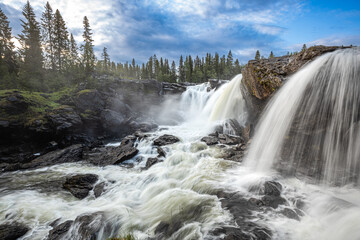 Ristafallet waterfall in the western part of Jamtland is listed as one of the most beautiful...