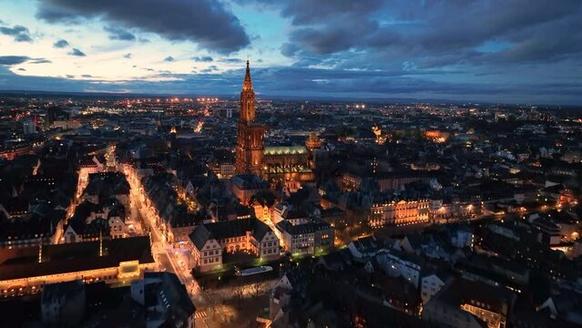 4K Aerial view of a Cathedral of Notre Dame, buildings architecture with night sky view. Strasbourg France