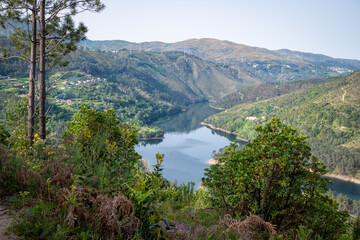 Obraz na płótnie Canvas Landscape view on dammed Cávado river reservoir and village Frades, municipality of Vieira do Minho, district of Braga, Portugal